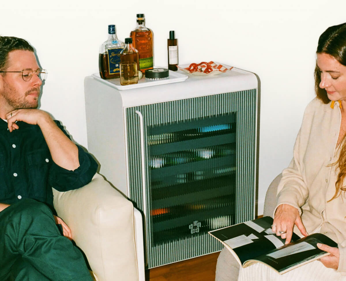 A couple basking in the glow of their Rocco fridge.