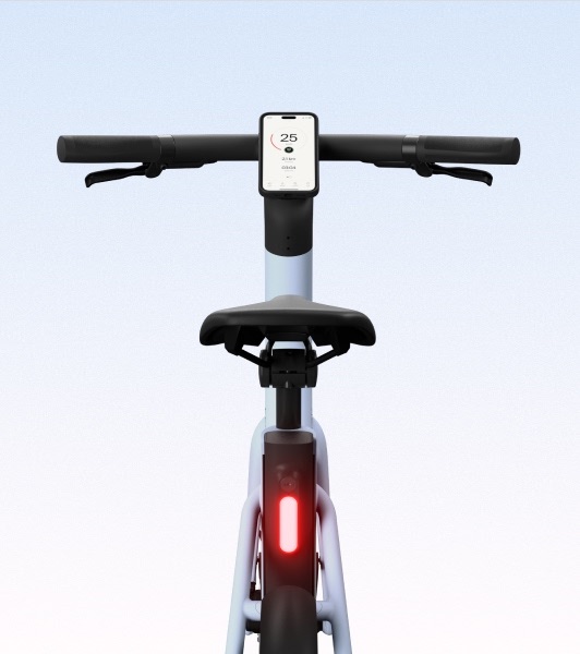 A close-up of the rear section of the Cowboy bike in Breeze, showcasing the seat, battery integration, and frame details.