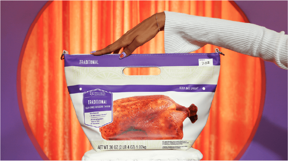 Rotisserie chicken purse with hand on it