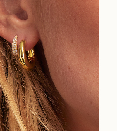 Model shot with gold hoops and huggies