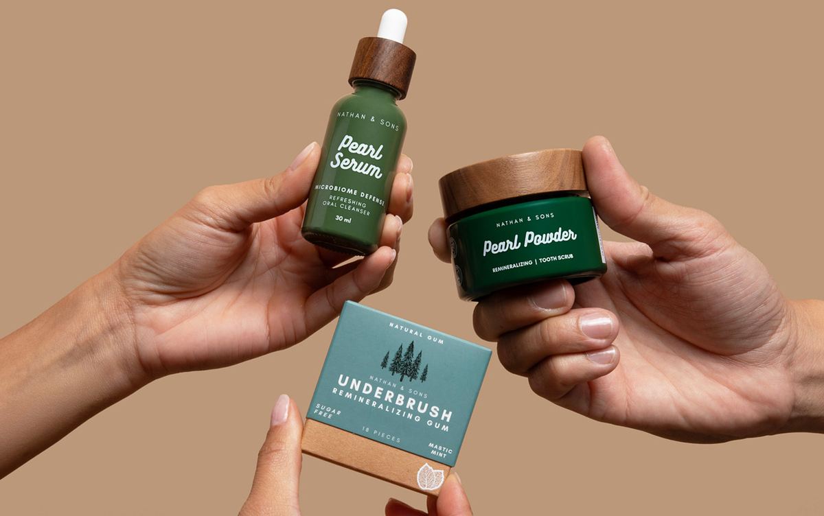 Hands holding Pearl Serum, Pearl Powder and Underbrush gum