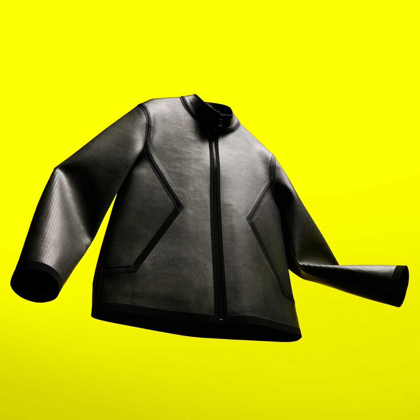 Grey zip-front Vollebak Rock Jacket displayed against a bright yellow background.