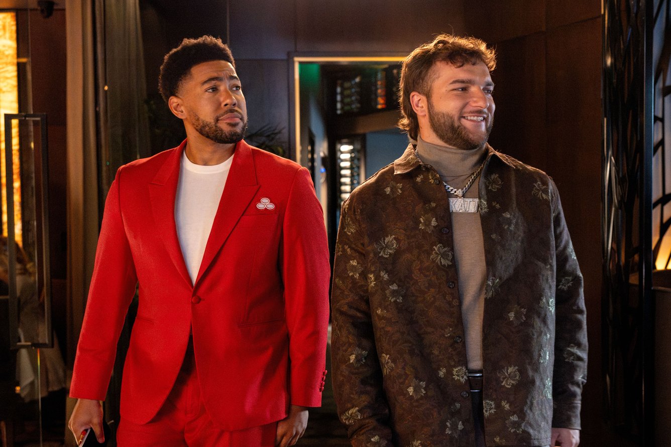 Jake from State Farm and Cam Skattebo standing side by side in a commercial.