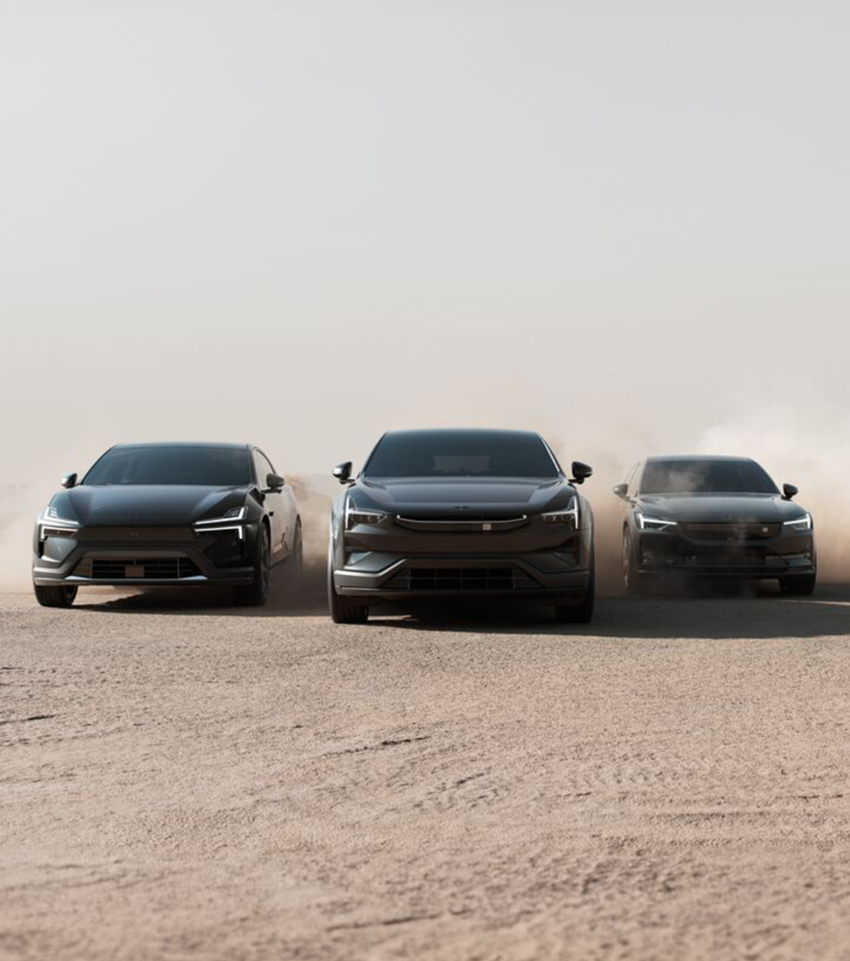 Lineup of Polestar cars. Polestar 2, Polestar 3 and Polestar 4 coupe driving in California desert.