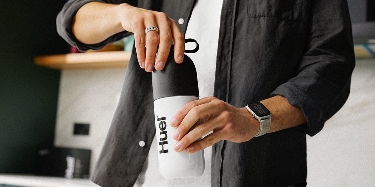 Person preparing a Huel Black Edition