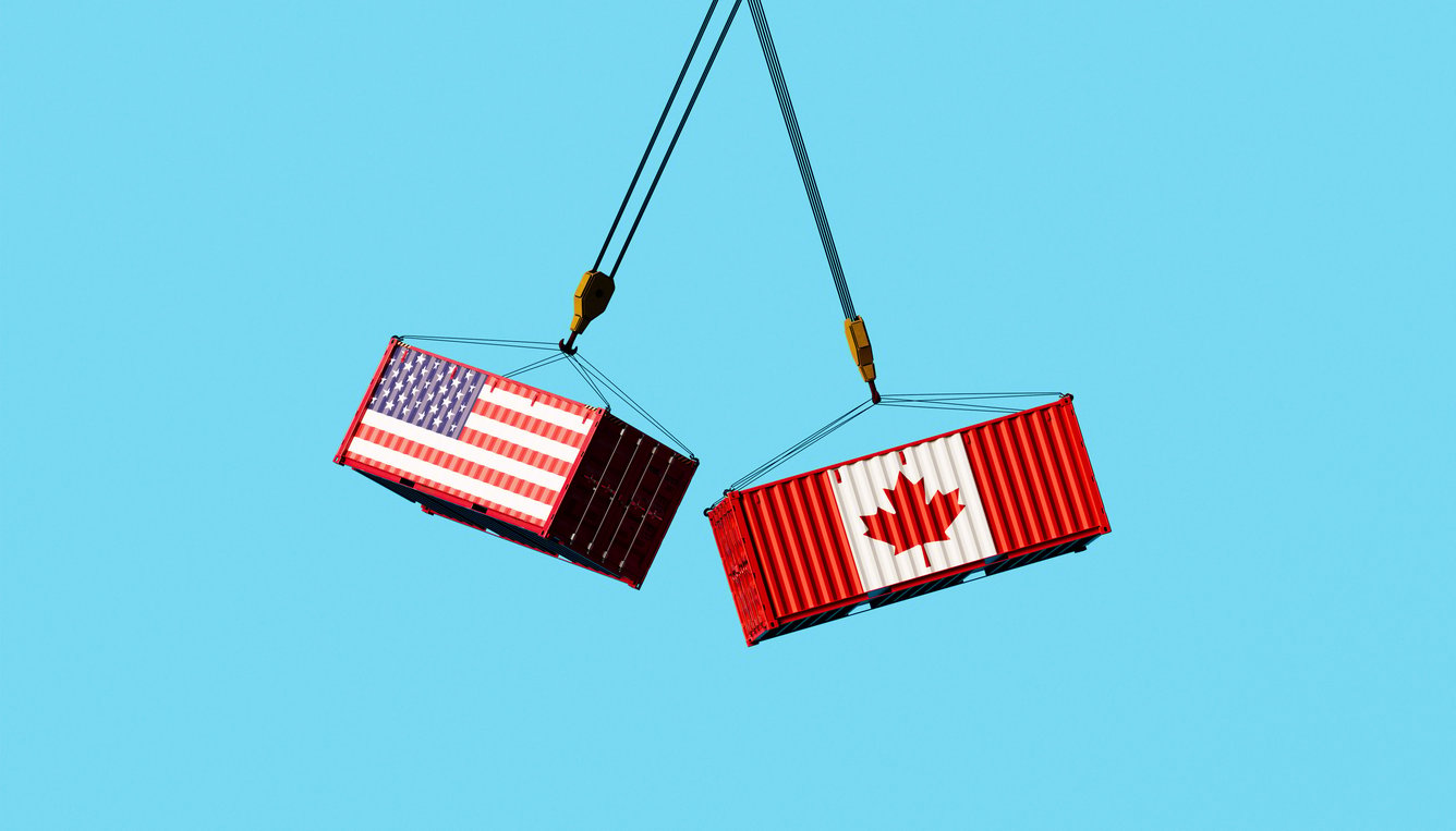 American and Canadian freight containers dangling mid-air on bright blue sky depicting North American commerce rivalry