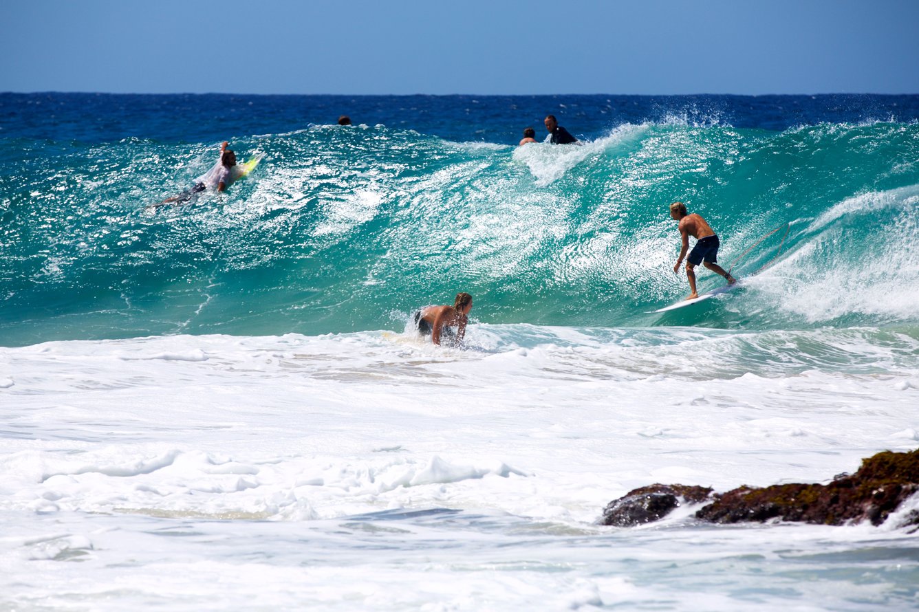 Surfers in the water at Snapper Rocks, Gold Coast.