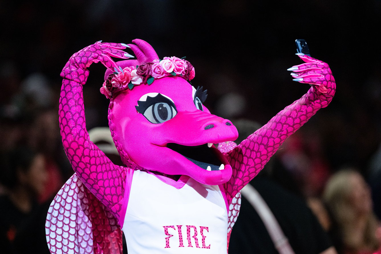 Portland Fire mascot Rose, a pink, glitter-breathing dragon.