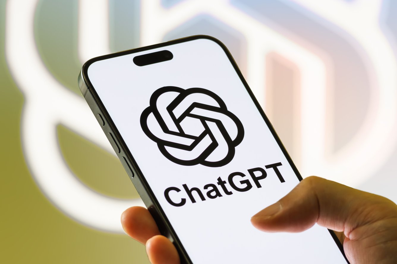 An iPhone showing the ChatGPT logo on screen