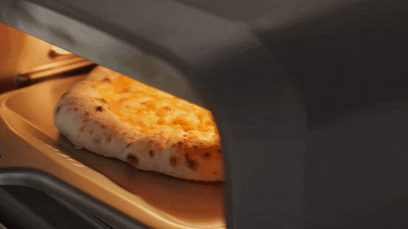 A gif of a pumpkin base pizza being made with the Ooni Halo Core and Ooni Volt 2