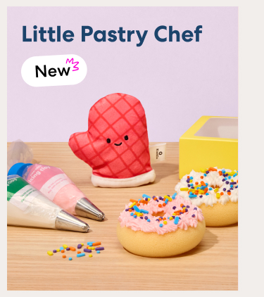 New - Little Pastry Chef. A playful baking set with a smiling red oven mitt, frosted pastries, piping bags filled with icing, and colorful sprinkles.