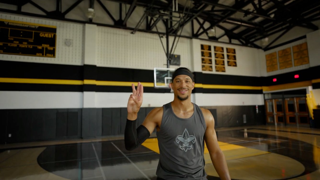New York Knicks guard Josh Hart doing the scout sign in Scouting America recruitment campaign video.