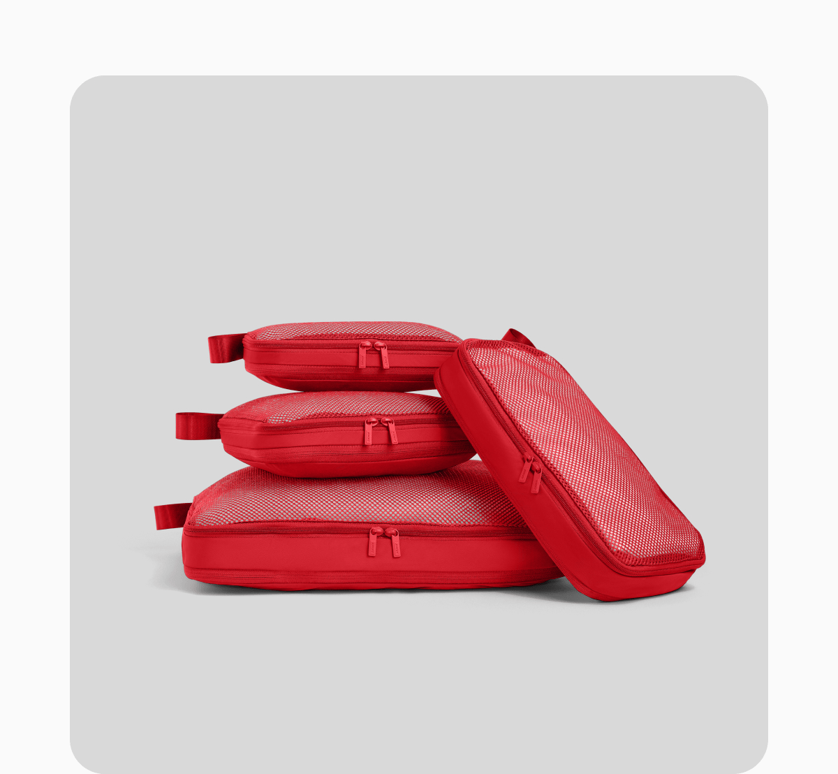 PAINT THE TRIP RED | We made unpacking look good. Now go take all the credit. Complete the look with new Cherry Red packing cubes, travel accessories, and more.