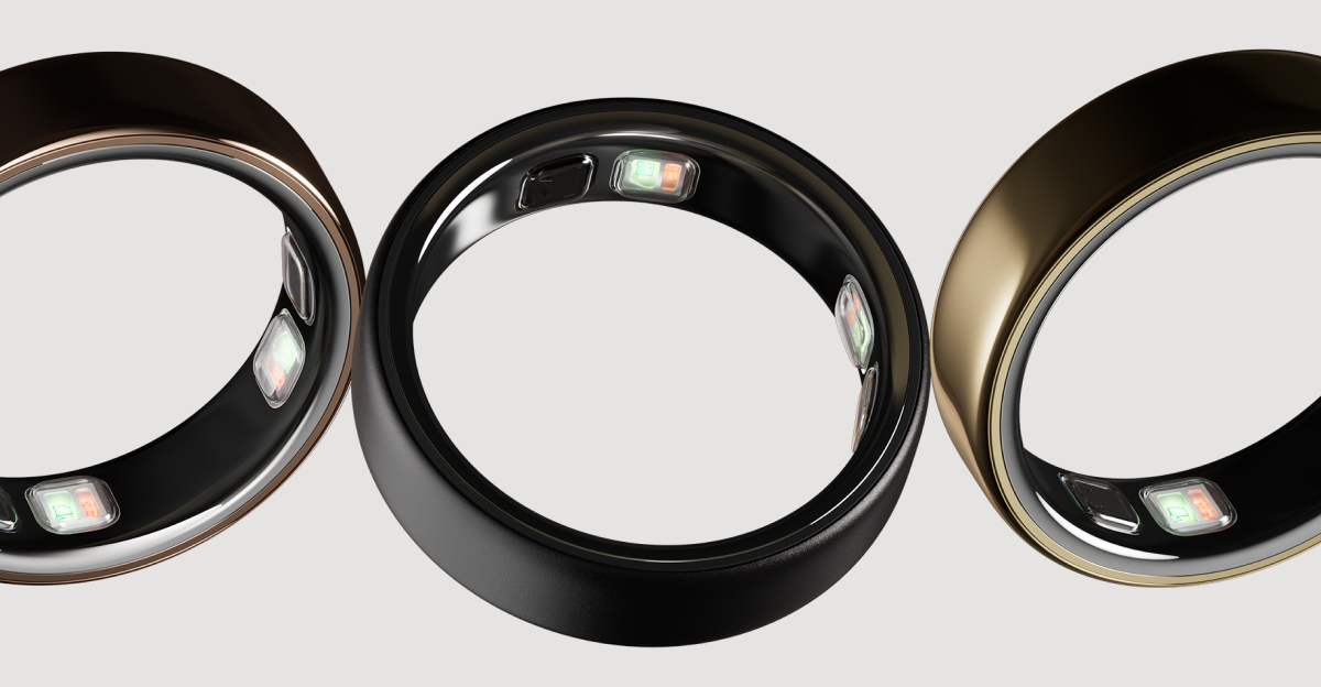 3 Oura Rings shown at an angle against a light gray background &mdash; a deep rose ring on the left, a black ring in the center, and a gold ring on the right &mdash; each showing the sensor bumps on the inner band.