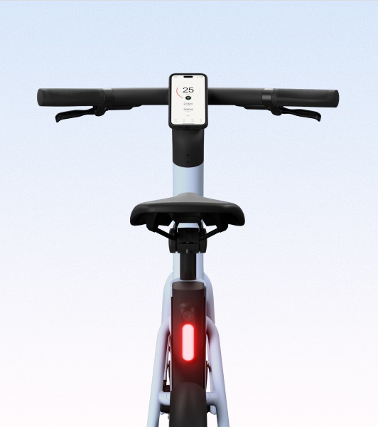 A close-up of the rear section of the Cowboy bike in Breeze, showcasing the seat, battery integration, and frame details.