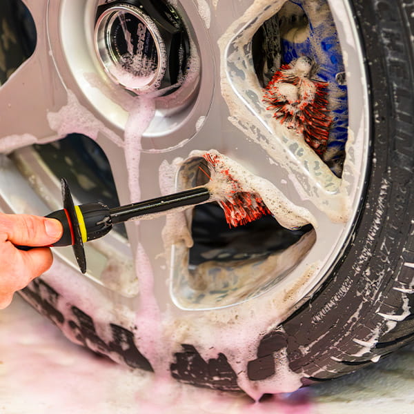 brush that bends behind wheel