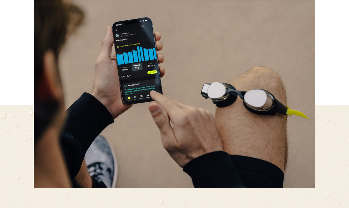 FORM smart swim goggles synced with the FORM app on a phone