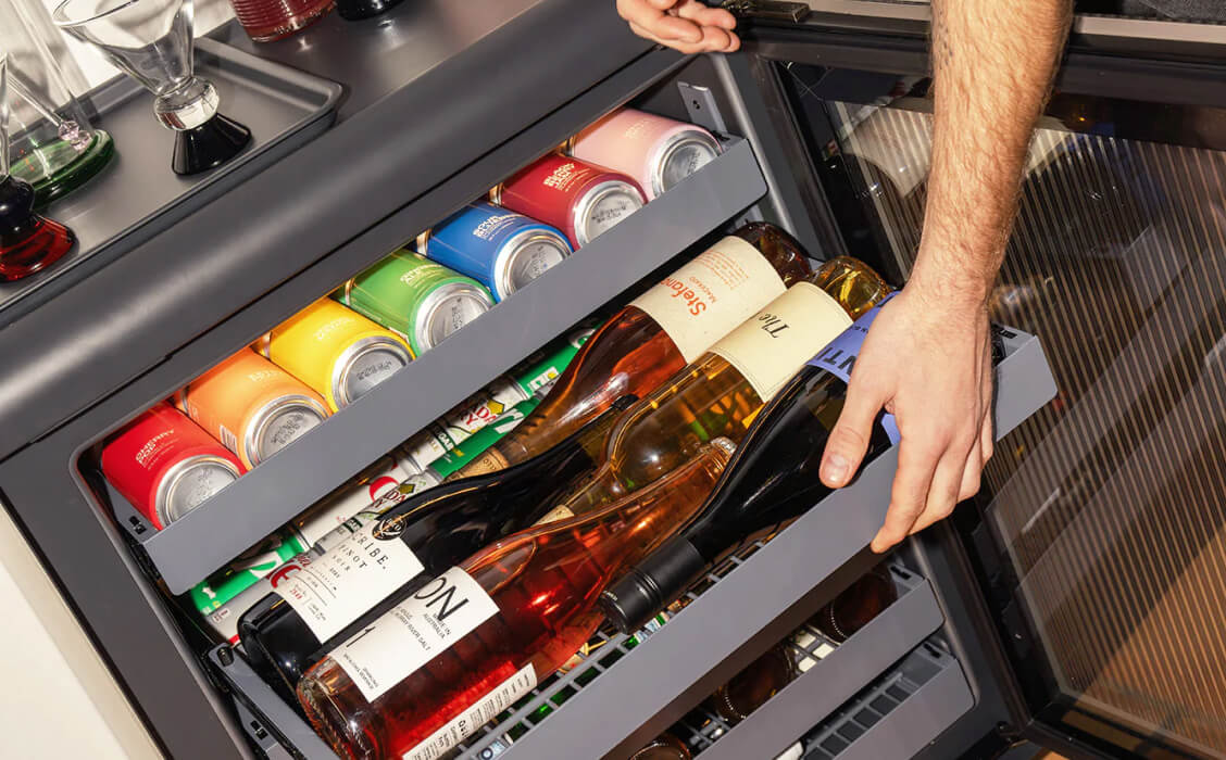 A Rocco fridge stocked with wine and soda