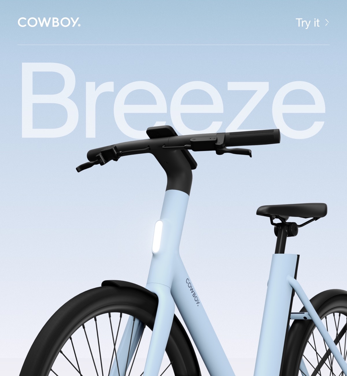 A Cowboy e-bike in the Breeze colorway, a soft blue frame with black accents, shown from a low angle against a gradient background with the word &ldquo;Breeze&rdquo; in large text.