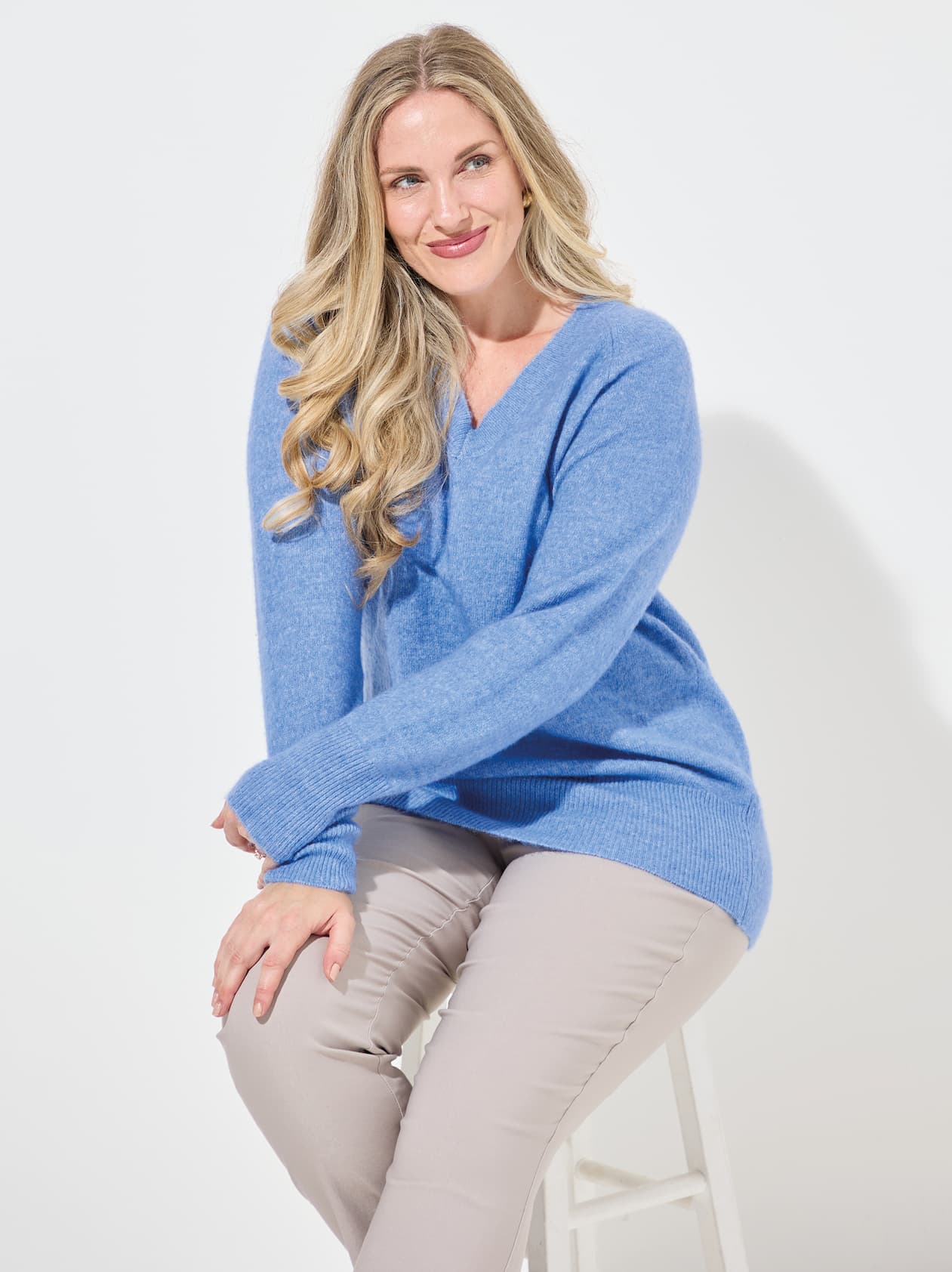 Woman wearing blue jumper
