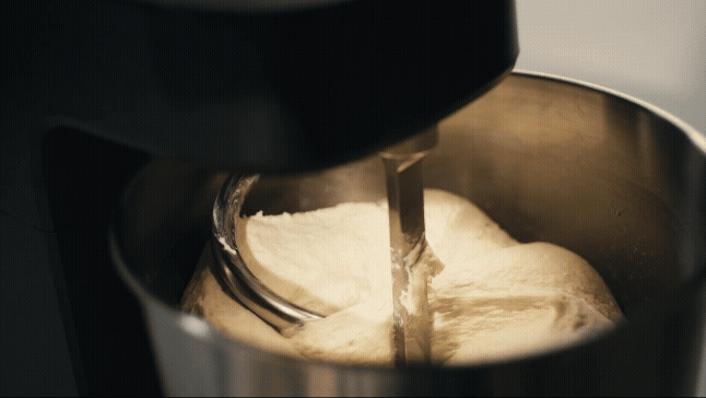 A gif of Halo Core mixing dough into a pumpkin shape.