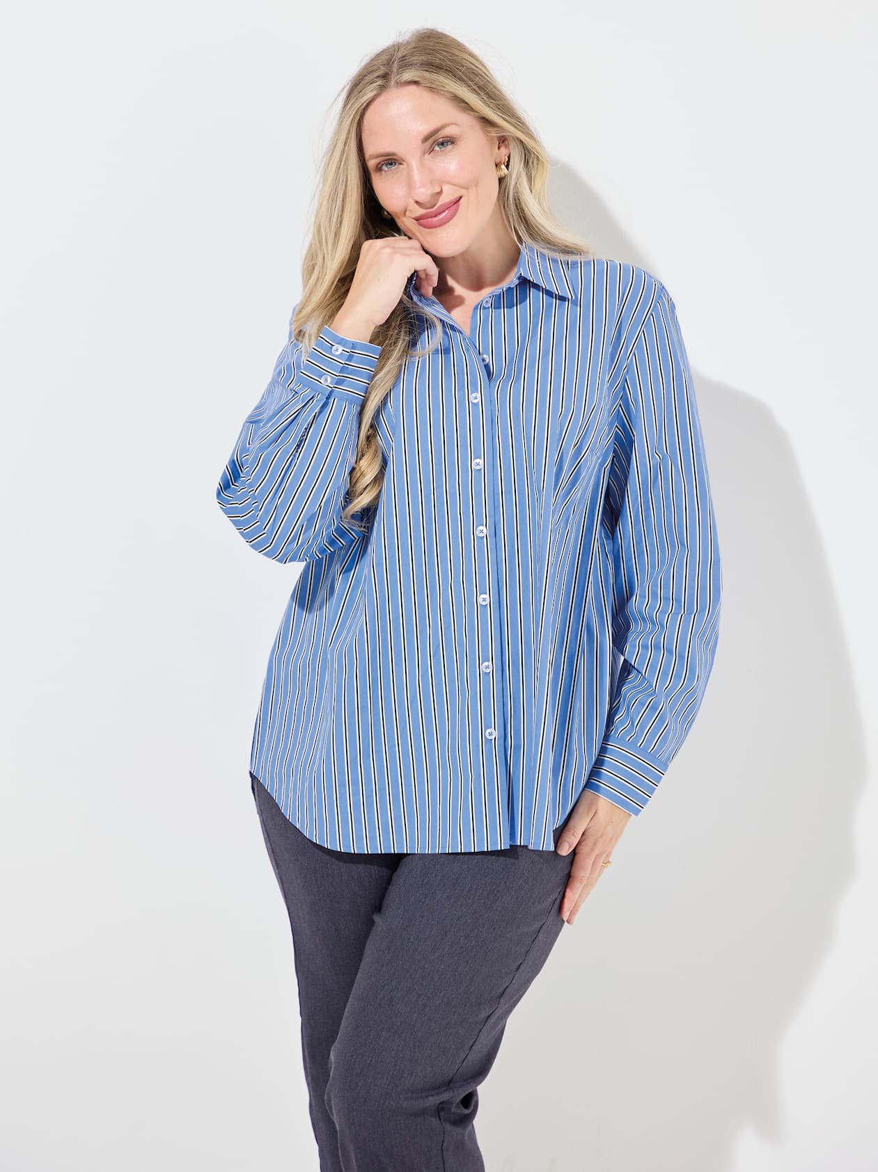 Woman wearing blue stripe shirt